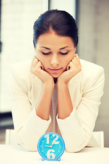 Image showing businesswoman with clock