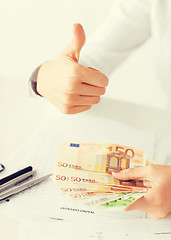 Image showing woman hands with euro cash money and thumbs up