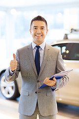 Image showing happy man at auto show or car salon