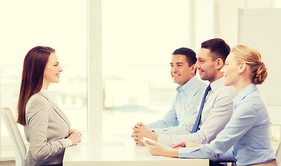 Image showing smiling businesswoman at interview in office