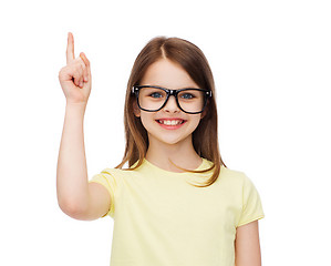 Image showing smiling cute little girl in black eyeglasses