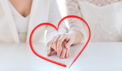 Image showing close up of happy married lesbian couple hands