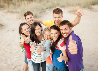 Image showing group of happy friends having fun on beach