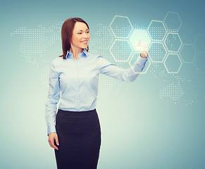 Image showing smiling businesswoman working with virtual screen