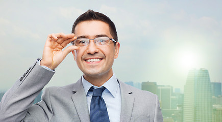 Image showing happy smiling businessman in eyeglasses and suit