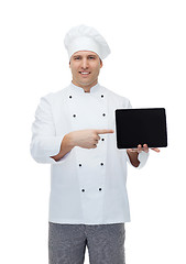 Image showing happy male chef cook showing with tablet pc