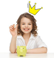 Image showing smiling girl with piggy bank and euro coin