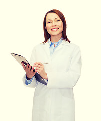 Image showing smiling female doctor with clipboard