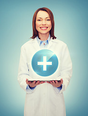 Image showing smiling female doctor and tablet pc computer