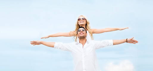 Image showing couple holding hands up at sea side