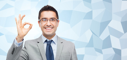 Image showing happy smiling businessman in eyeglasses and suit