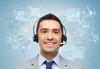 Image showing smiling businessman in headset