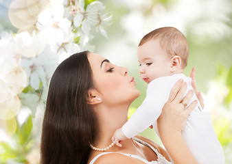 Image showing happy laughing baby playing with mother