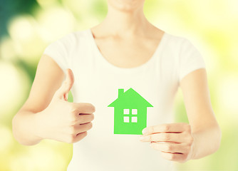 Image showing woman hands holding green house