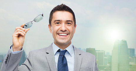 Image showing happy smiling businessman in eyeglasses and suit