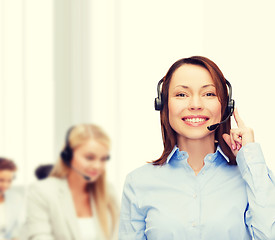 Image showing friendly female helpline operator at office