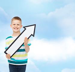 Image showing smiling little boy with blank arrow pointing right