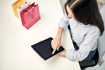 Image showing close up of woman with tablet pc at office