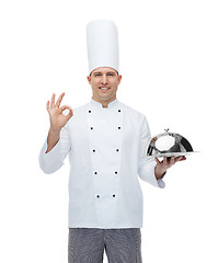 Image showing happy male chef cook with cloche showing ok sign