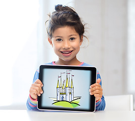 Image showing little girl showing castle on tablet pc screen