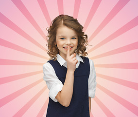 Image showing happy girl showing hush gesture