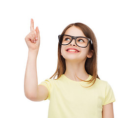 Image showing smiling cute little girl in black eyeglasses