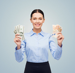 Image showing businesswoman with dollar and euro cash money