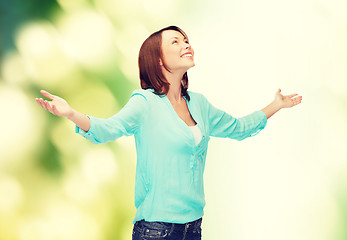 Image showing smiling woman waving hands