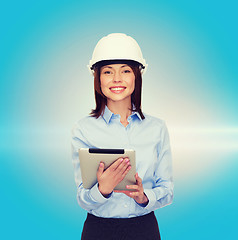 Image showing young smiling businesswoman in white helmet