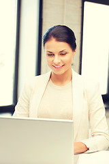 Image showing happy woman with laptop computer