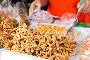 Image showing close up of cook hands and snacks at street market