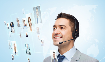 Image showing smiling businessman in headset
