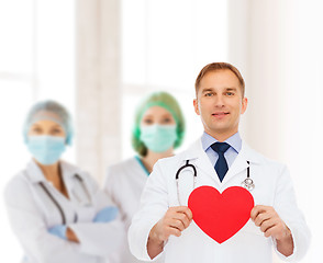 Image showing smiling male doctor with red heart and stethoscope