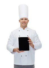 Image showing happy male chef cook showing with tablet pc