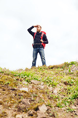 Image showing tourist with beard and backpack looking far away