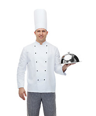 Image showing happy male chef cook holding cloche