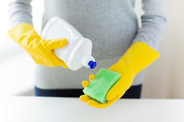 Image showing close up of woman with sponge and cleanser