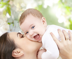 Image showing happy laughing baby playing with mother