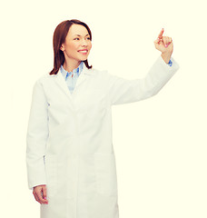 Image showing doctor pointing to something or pressing button