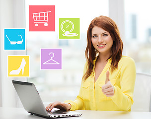 Image showing smiling woman with laptop shopping online at home