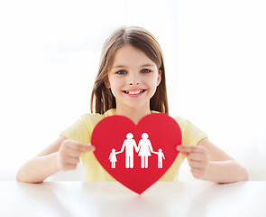 Image showing smiling little girl with red heart and family