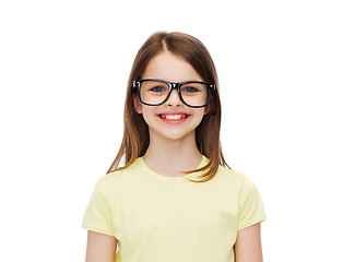 Image showing smiling cute little girl in black eyeglasses