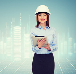 Image showing young smiling businesswoman in white helmet