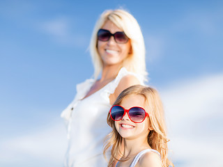 Image showing mother and child in sunglasses