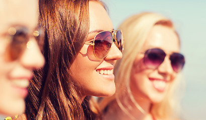 Image showing close up of smiling young women in sunglasses
