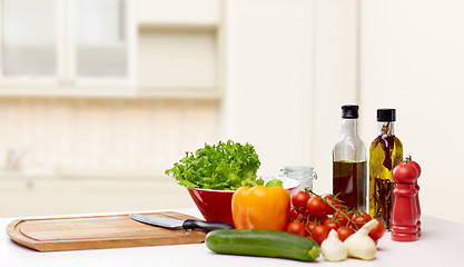 Image showing vegetables, spices and kitchenware on table