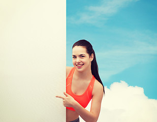 Image showing teenage girl in sportswear with white board