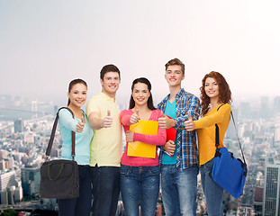 Image showing group of smiling teenagers showing thumbs up