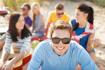 Image showing group of happy friends having fun on beach