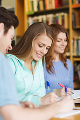 Image showing students preparing to exam and writing in library
